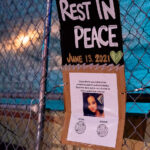 Signs on the fence around Seven Points Mall in Uptown Minneapolis reading:“Deona Marie was killed while protesting against police brutality. Read her story below and donate to help support her children.”