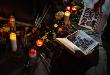 A vigil for Winston Smith on the 4 month anniversary of his death by law enforcement in Minneapolis. Smith was shot and killed on top of the parking ramp by a federal task force.