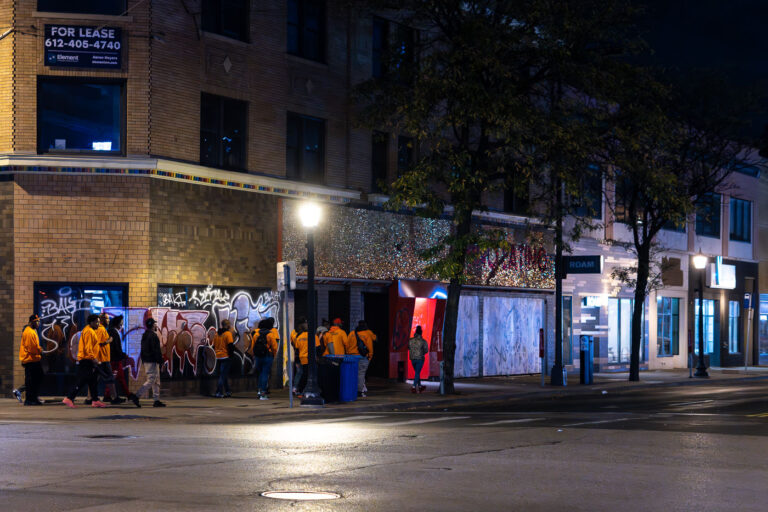 Violence Interrupters at Hennepin and Lake Street 4 "Outreach" workers walking in Uptown Minneapolis.