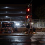 A vigil outside the parking ramp at Seven Points Mall where Winston Smith was killed 4 months prior.
