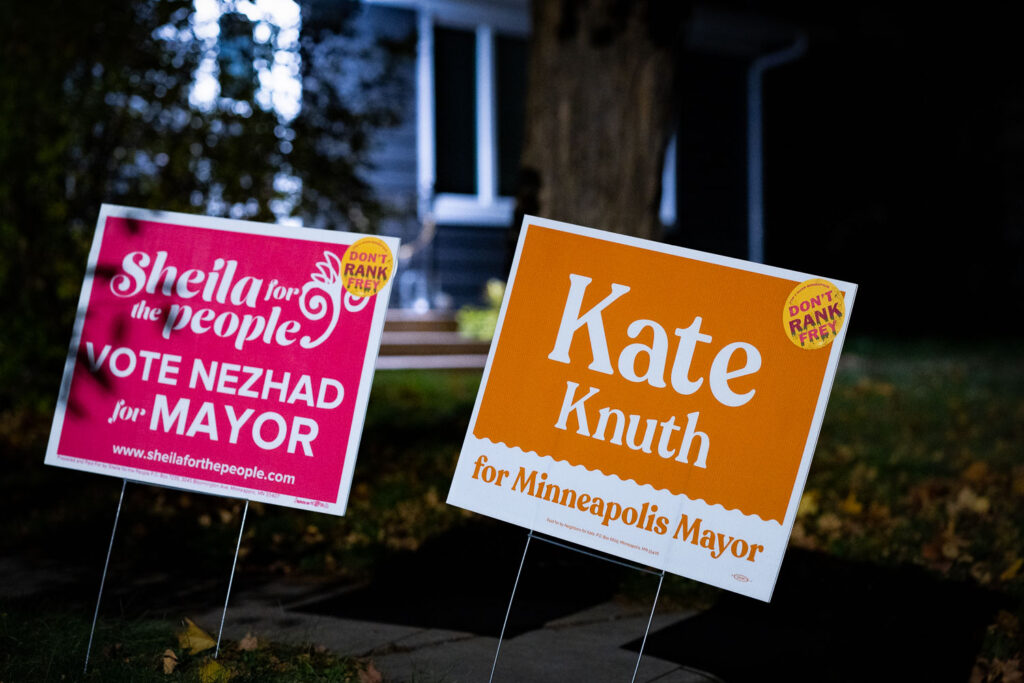 Yard signs for Kate Knuth and Sheila Nezhad together in a South Minneapolis yard.  Both with "Don't Rank Frey" stickers attached, referring to current Minneapolis Mayor Jacob Frey. Election in 2 days.