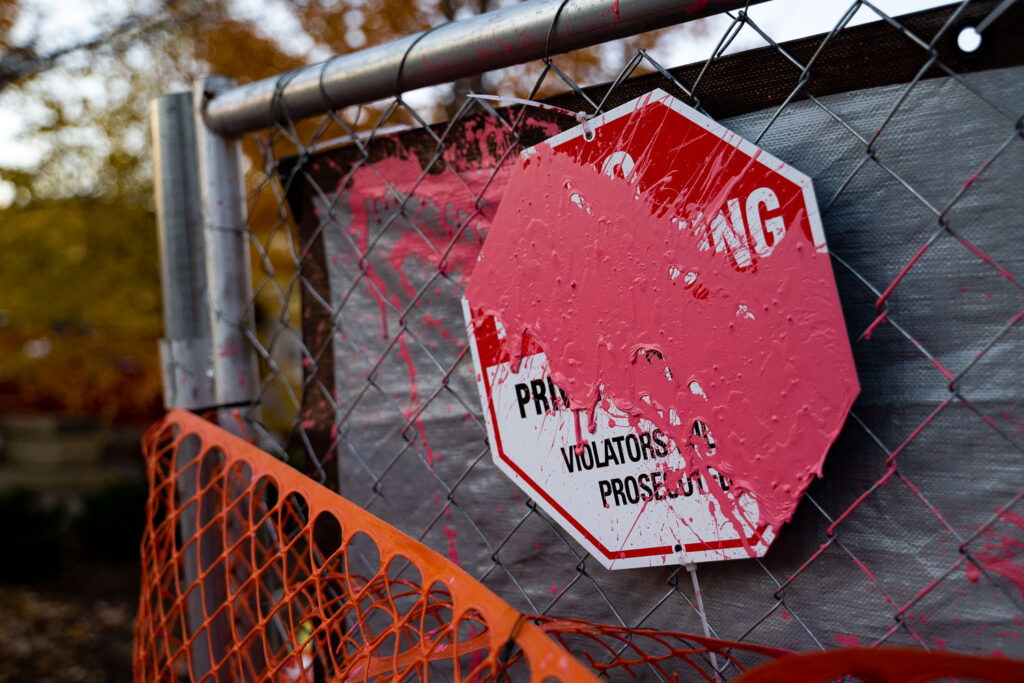 A paint covered No Trepassing sign outside the parking ramp where Winston Smith was killed by law enforcement on June 3, 2021.