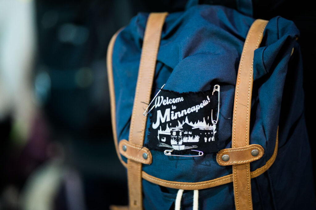 A protester with a "Welcome to Minneapolis!" patch during a march following the acquittal of Kyle Rittenhouse.