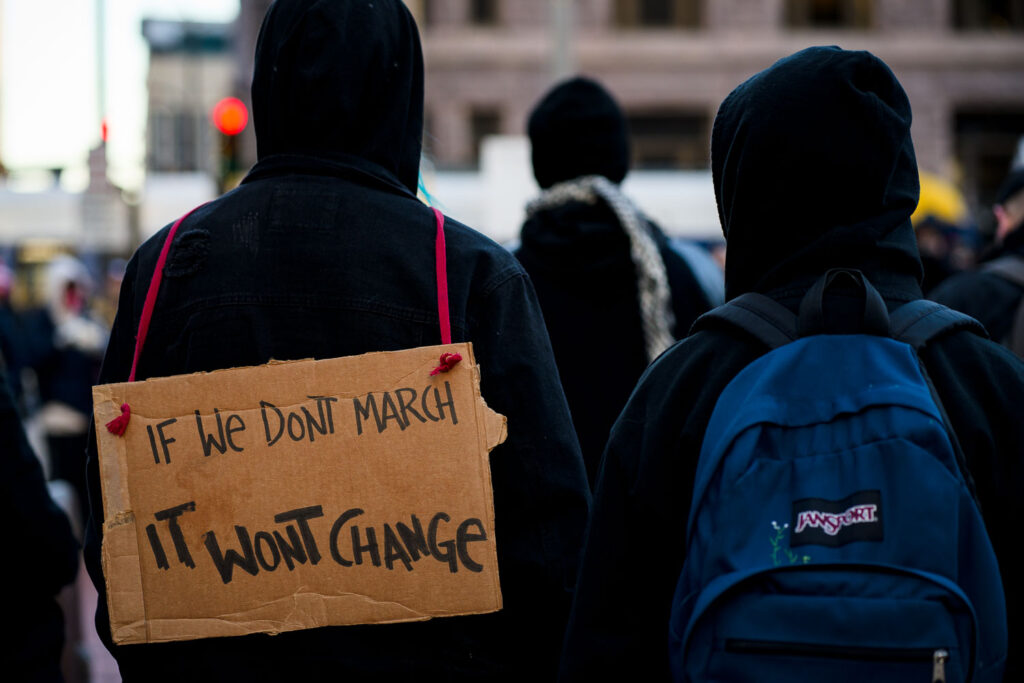 Protesters march after a rally at the Hennepin County Government Center. A day earlier, Kyle Rittenhouse was found not guilty on all charges.