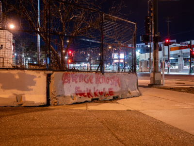 Graffiti on barricade at Minneapolis Police 3rd Precinct