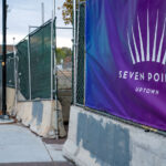 Security fencing and signage on the Seven Points mall parking garage.