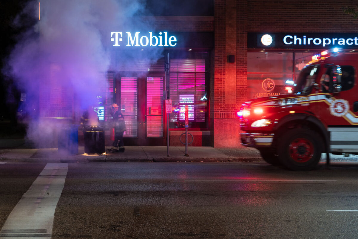 The Minneapolis Fire Department puts out garbage can fires on Lake Street the day after the election in Uptown Minneapolis.