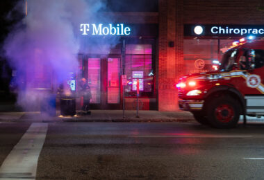 The Minneapolis Fire Department puts out garbage can fires on Lake Street the day after the election in Uptown Minneapolis.