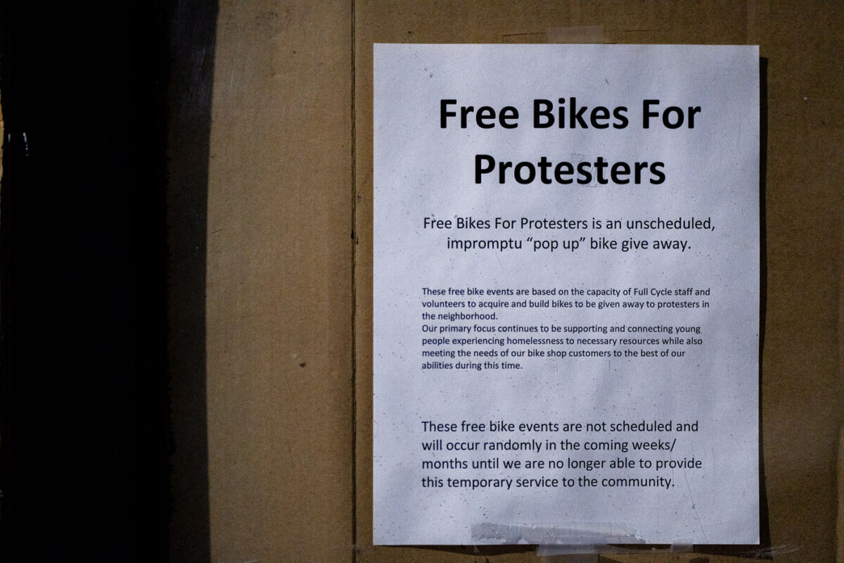 "Free bikes for protesters" seen on a bike shop window in Minneapolis.
