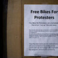 "Free bikes for protesters" seen on a bike shop window in Minneapolis.