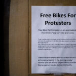 "Free bikes for protesters" seen on a bike shop window in Minneapolis.