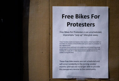 "Free bikes for protesters" seen on a bike shop window in Minneapolis.