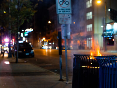 Garbage cans on fire in Uptown Minneapolis, day after election