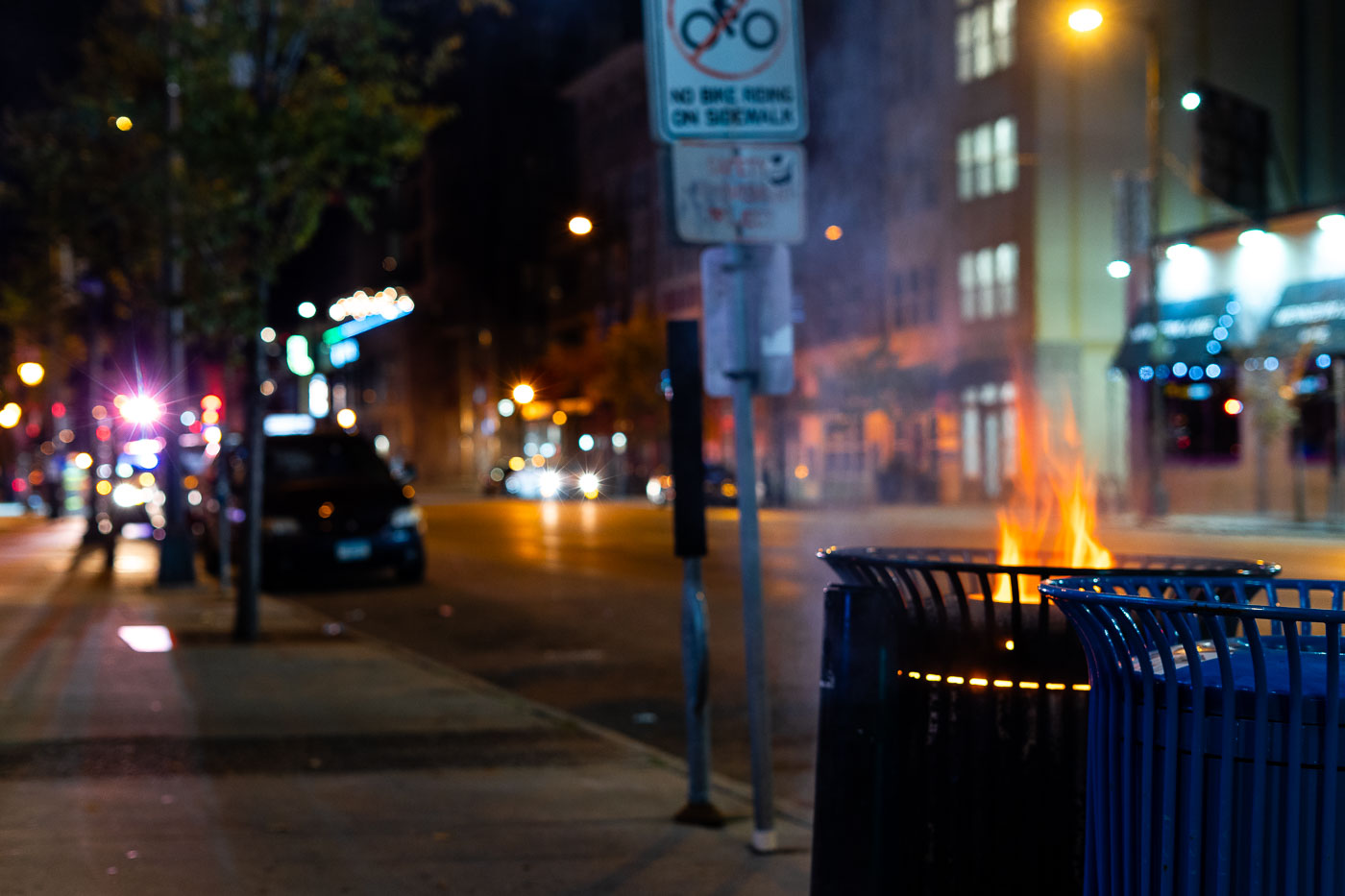 Garbage cans on fire the day after election in Uptown Minneapolis