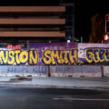 Winston Smith graffiti on banner surrounding the parking ramp he was killed by law enforcement in Uptown Minneapolis