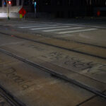 Graffiti on Light Rail tracks outside the Hennepin County Public Safety Facility.