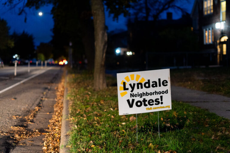 Lyndale Neighborhood Votes Yard Sign, South Minneapolis 2 A yard sign in the Lyndale Neighborhood of South Minneapolis encourages residents to vote. The sign, which reads "Lyndale Neighborhood Votes!" and directs viewers to "Visit mnvotes.org," reflects local civic engagement efforts. Such signs are common during election seasons, serving as a visible reminder of the importance of participation in democratic processes. The presence of this sign in a residential area highlights the neighborhood's commitment to voter turnout.
