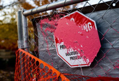 A paint covered No Trespassing sign outside the parking ramp where Winston Smith was killed by law enforcement on June 3, 2021.