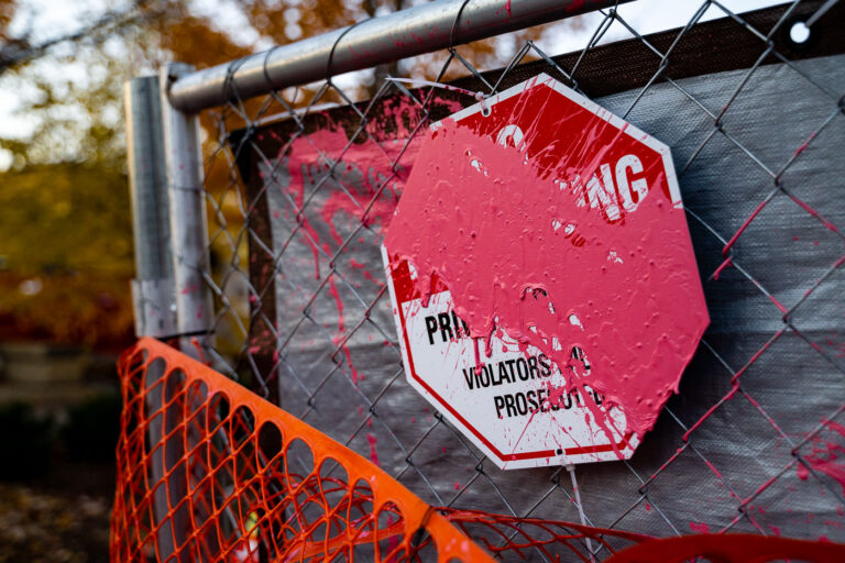 Paint covered No Trespassing sign 4 A paint covered No Trespassing sign outside the parking ramp where Winston Smith was killed by law enforcement on June 3, 2021.