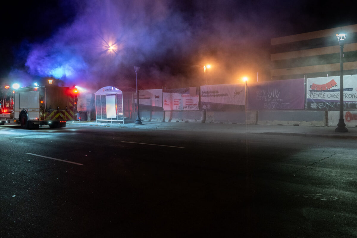 Minneapolis Fire Department puts out garbage can fires on Lake Street the night after the election.