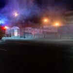 Minneapolis Fire Department puts out garbage can fires on Lake Street the night after the election.