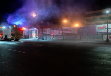 Minneapolis Fire Department puts out garbage can fires on Lake Street the night after the election.