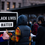 A protester holds up a Black Lives Matter sign outside the Hennepin County Government Center.