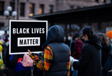 A protester holds up a Black Lives Matter sign outside the Hennepin County Government Center.