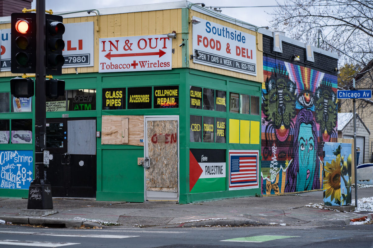 Southside Food & Deli on Chicago Avenue in South Minneapolis with boards and a Free Palestine flag.