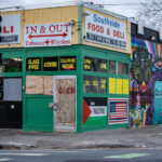 Southside Food & Deli on Chicago Avenue in South Minneapolis with boards and a Free Palestine flag.
