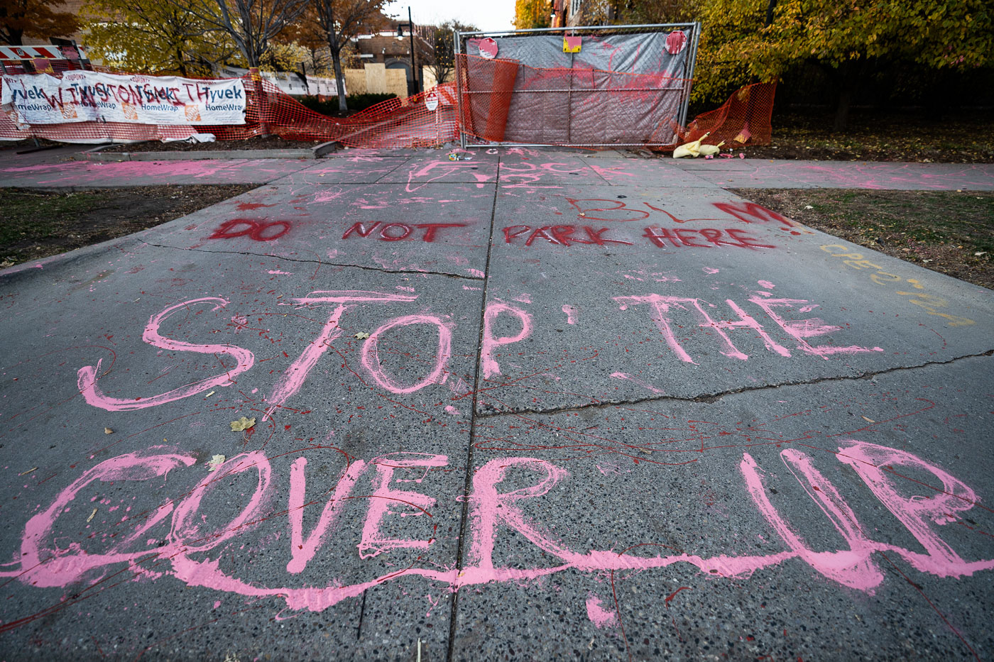 Stop The Cover Up graffiti behind Seven Points Mall