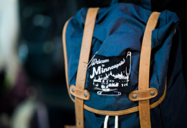 A protester with a "Welcome to Minneapolis!" patch during a march following the acquittal of Kyle Rittenhouse.