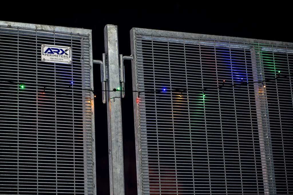 Holiday lights hanging on the ARX security fencing that surrounds the station.