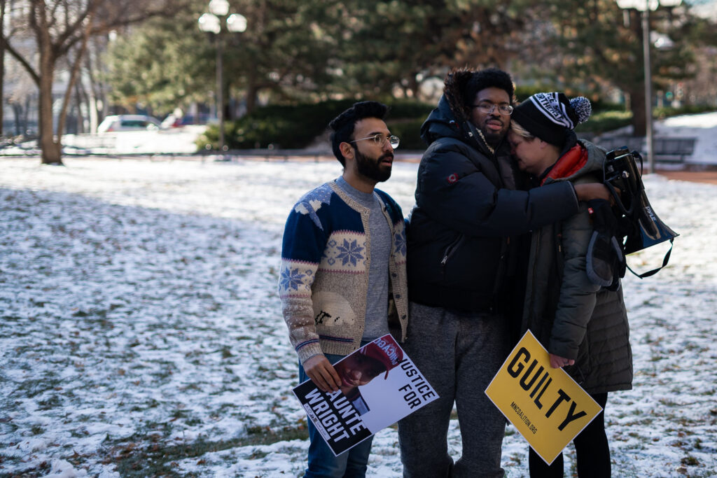 George Floyd's girlfriend Courteney Ross reacts along with activists outside the courthouse as the jury finds former Brooklyn Center police officer Kim Potter guilty on all counts of manslaughter in the death of Daunte Wright.