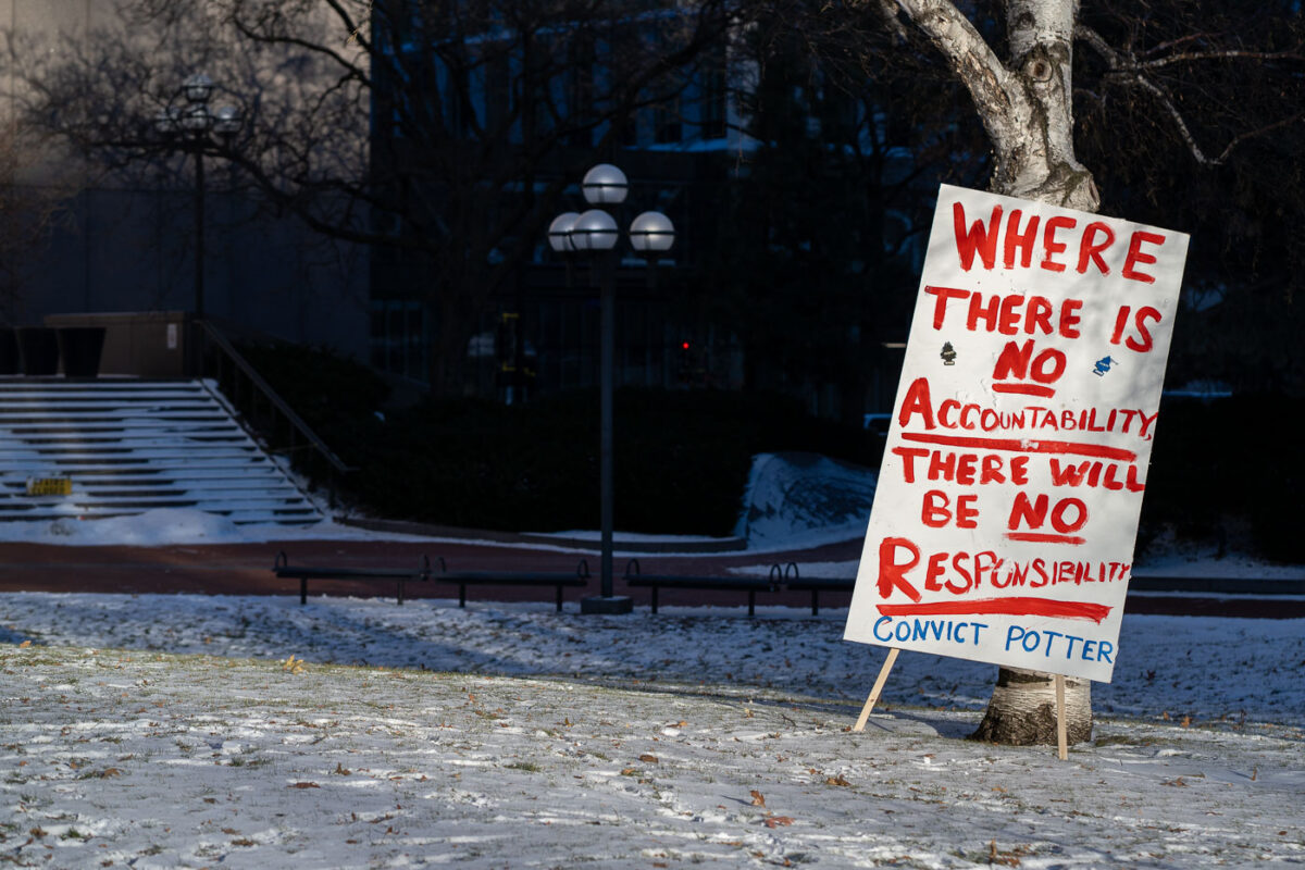 Accountability protest sign outside Kim Potter trial