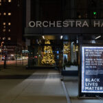 Sign outside Orchestra Hall in Downtown Minneapolis that reads: “Music teaches us the value of listening. There is more for us to hear and more for us to do. Black Lives Matter”.