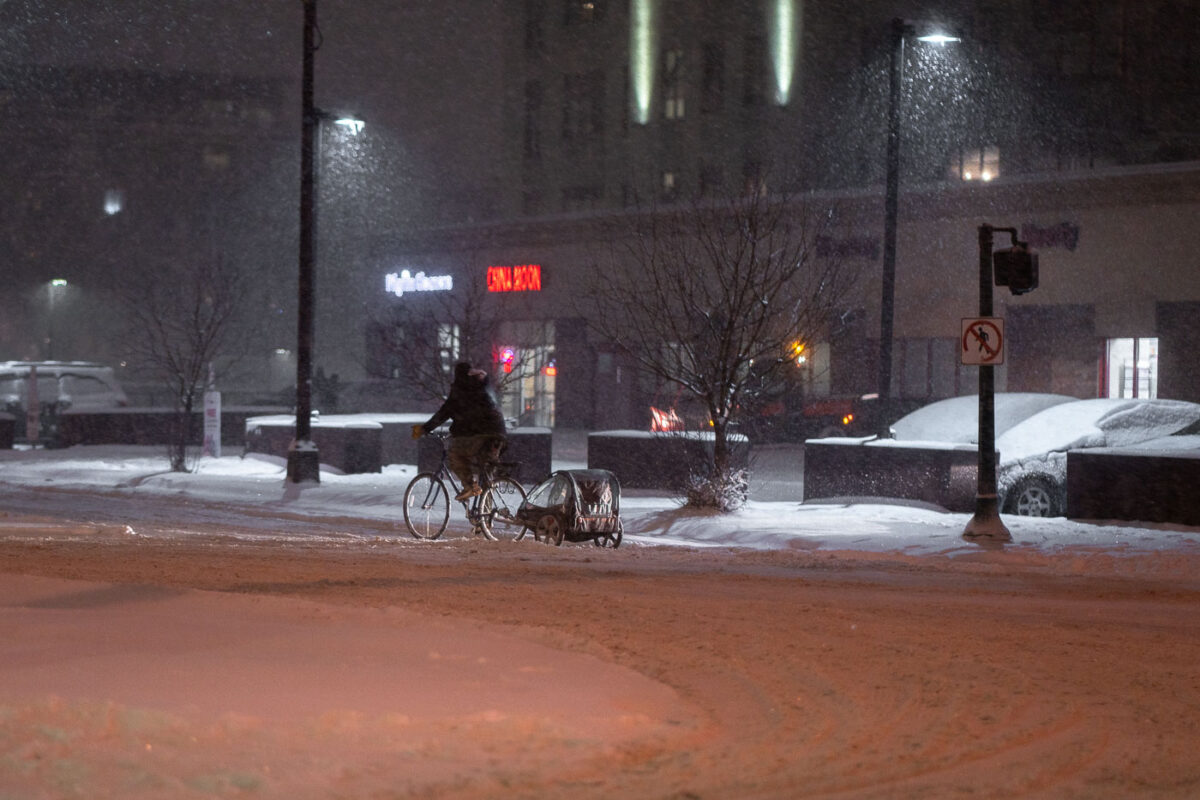 Uptown Minneapolis biking during snowfall