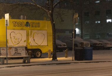 A Taco Taxi food truck on Lagoon Avenue in Uptown Minneapolis after a fresh snowfall.