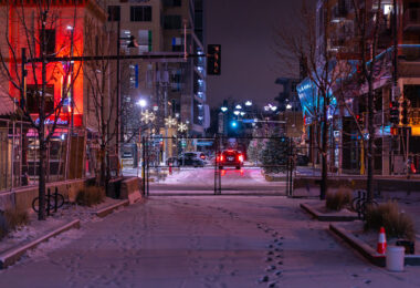Fresh snow covers the private drive next to the Seven Points parking ramp. The area fenced off after protests over the law enforcement killing of Winston Smith on June 3rd, 2021.
