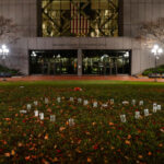Candles in a shape of a heart outside the courthouse where jury selection has begun in the Kim Potter trial. Potter is charged in the April 2021 shooting death of Daunte Wright.