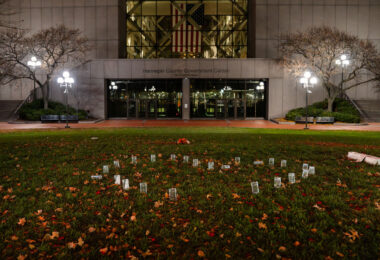 Candles in a shape of a heart outside the courthouse where jury selection has begun in the Kim Potter trial. Potter is charged in the April 2021 shooting death of Daunte Wright.