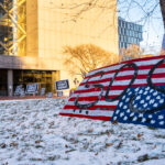 Justice for Daunte Wright signs outside the Hennepin County Government Center where Kim Potter is being tried for her involvement in his killing.
