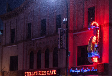 Stella's Fish Cafe restaurant on Lake Street in Uptown Minneapolis during a December snowfall.