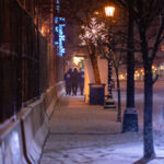"We push for peace", a nonprofit organization that partners with police to de-escalate situations walks through Uptown Minneapolis on a snowy December evening.