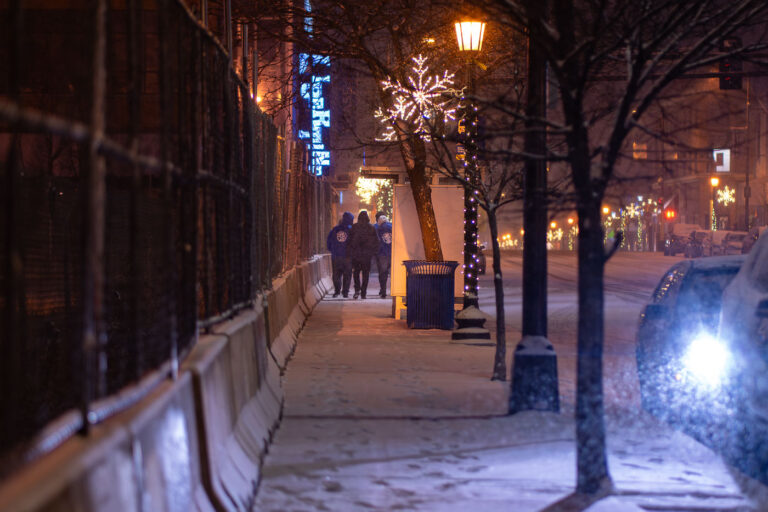 We Push For Peace in Uptown Minneapolis 2 "We push for peace", a nonprofit organization that partners with police to de-escalate situations walks through Uptown Minneapolis on a snowy December evening.