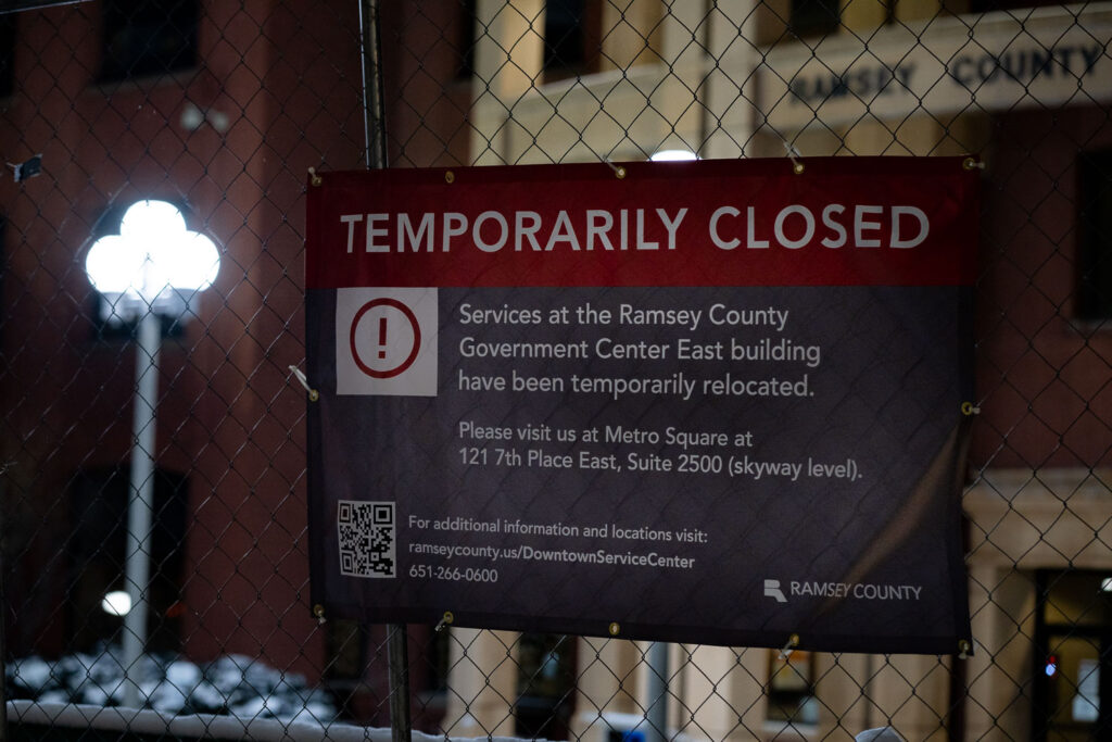 Fencing around the Ramsey County Downtown Service Center the night before opening statements in the federal trial of officers accused of violating George Floyd's civil rights.