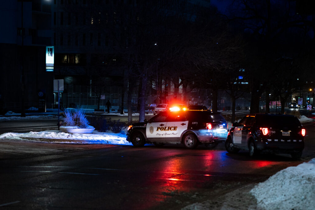 Outside the Warren E. Burger Federal Building on Day 3 of the federal trial where Thou Thao, J Alexander Kueng and Thomas Lane are accused of violating George Floyd's civil rights. St. Paul police block road in front of courthouse as a car caravan protest makes it's way through downtown.