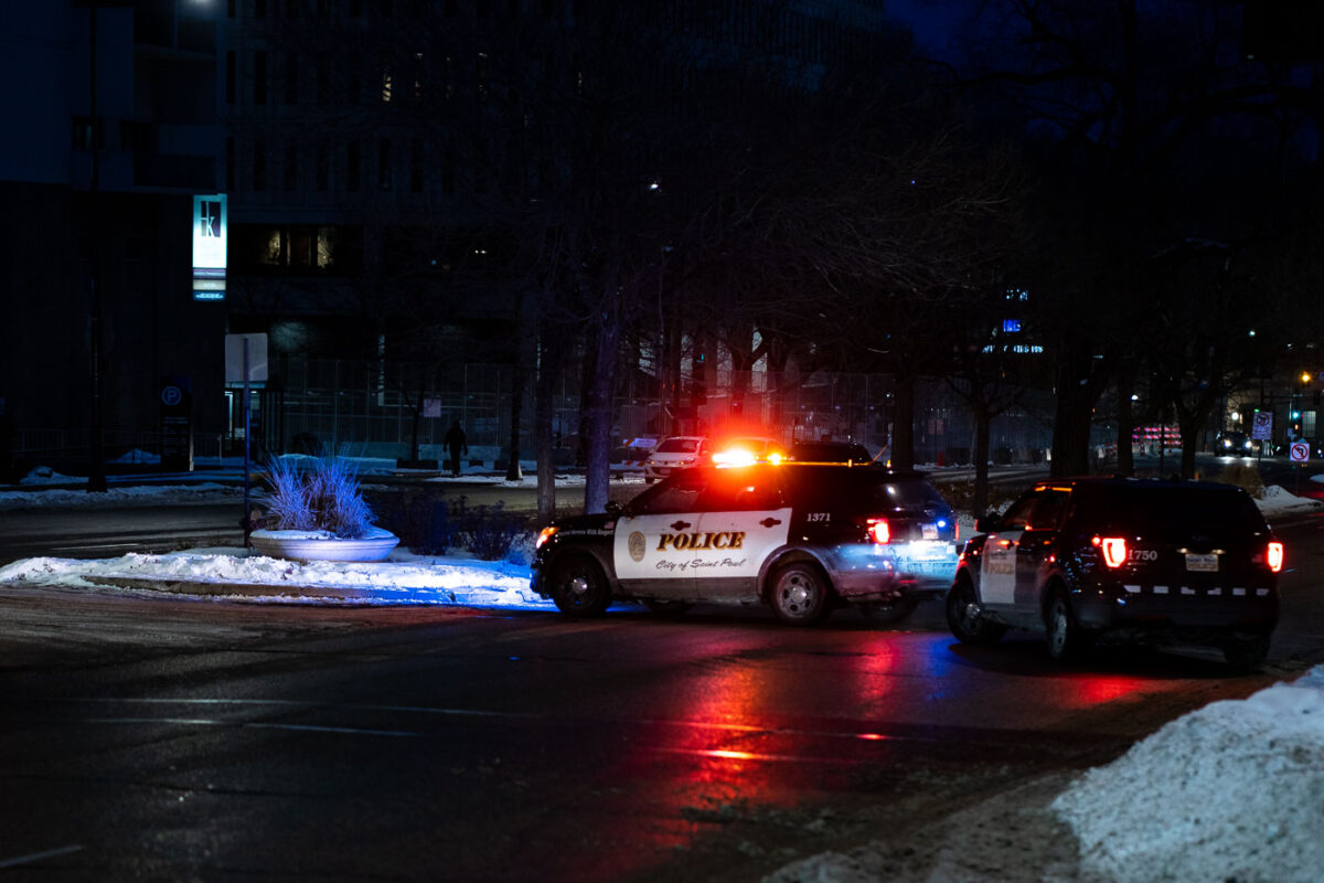 Outside the Warren E. Burger Federal Building on Day 3 of the federal trial where Thou Thao, J Alexander Kueng and Thomas Lane are accused of violating George Floyd's civil rights. St. Paul police block road in front of courthouse as a car caravan protest makes it's way through downtown.