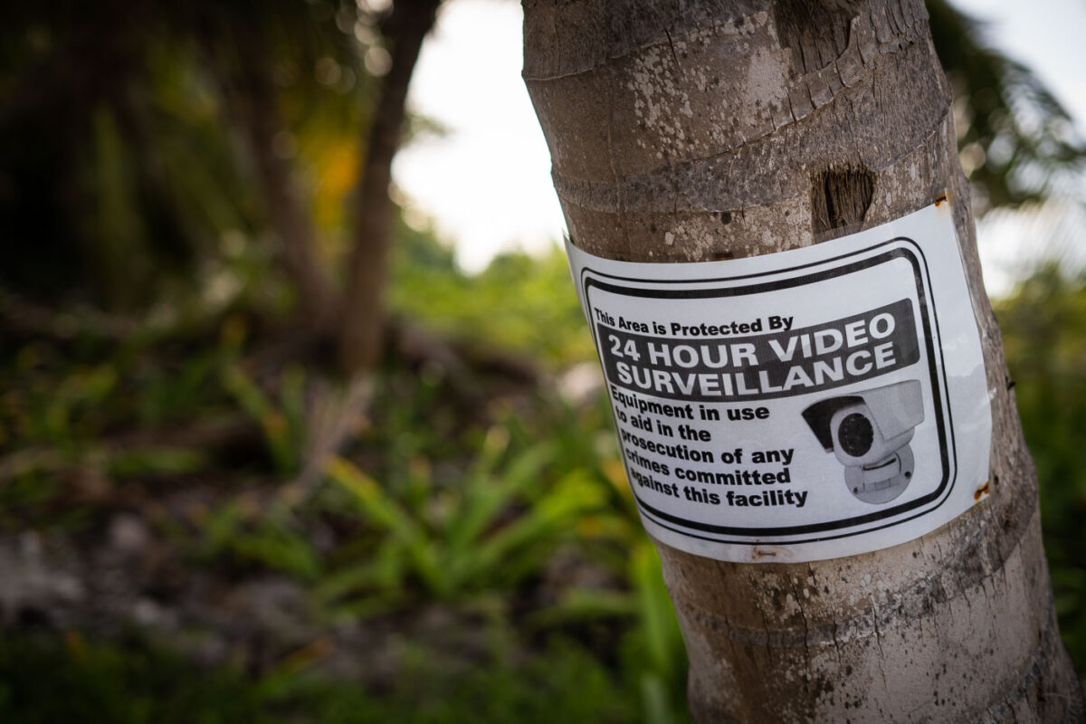 A sign taped to a tree in San Pedro Belize.