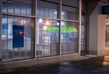 Security shutters on the windows of an AT&T Store on Lake Street in Minneapolis.